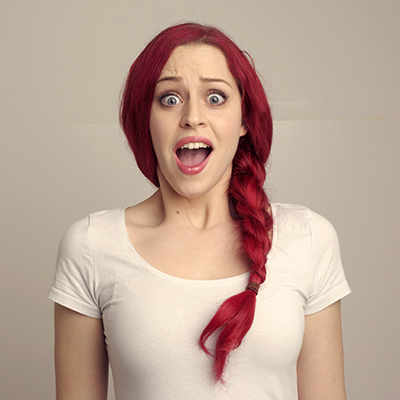 Woman with red hair with open mouth